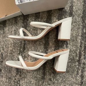 Lulu’s white heels
